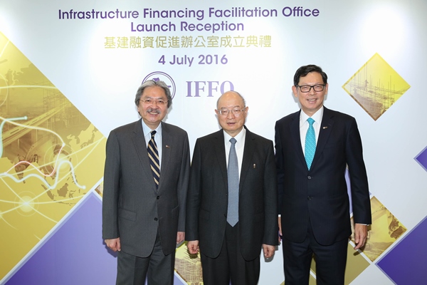Mr John C Tsang [left] and Mr Norman TL Chan [right] officiate at the launch of the IFFO. Mr Chen Yuan attends as the guest of honour.