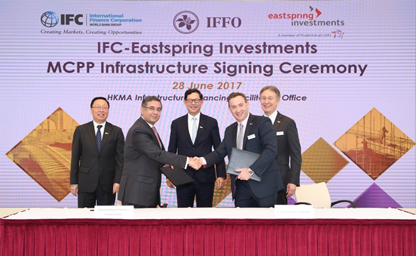 Mr Vivek Pathak, Director, East Asia & the Pacific, International Finance Corporation, (second from left) and Mr Tony Adams, Chief Investment Officer, Infrastructure, Eastspring Investments (second from right) sign an agreement on the MCPP Infrastructure Programme. The signing ceremony is witnessed by Mr Jingdong Hua, Vice President and Treasurer, International Finance Corporation (first from left), Mr Norman Chan, Chief Executive, Hong Kong Monetary Authority (centre), and Mr Donald Kanak, Chairman, Eastspring Investments (first from right).