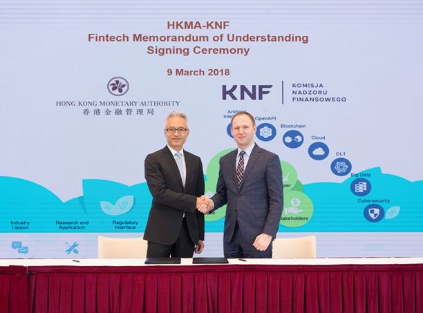 Mr Howard Lee(Left), Deputy Chief Executive of the HKMA and Mr Marek Chrzanowski, Chairman of the KNF sign and exchange the MoU in Hong Kong today (9 March 2018).