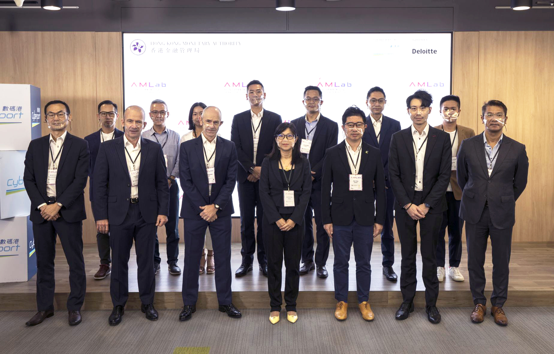 Ms Carmen Chu, Executive Director (Enforcement and AML), Hong Kong Monetary Authority (HKMA) (front row, fourth from left), Mr Rico Tang, Senior Manager, Fintech (Blockchain and Regtech), Cyberport (front row, third from right), Mr Stewart McGlynn, Head (AML and Financial Crime Risk), HKMA (front row, third from left) and representatives from InvestHK, Hong Kong Police Force, participating banks and technology firms, and Deloitte participate in the first AMLab today (5 November).