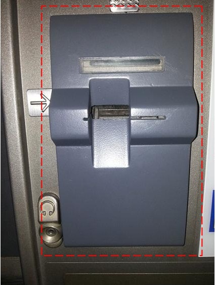 A card skimming device attached at the card insertion slot of an ATM