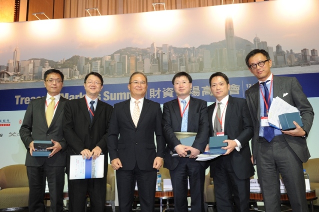 Mr Peter Pang, Deputy Chief Executive of the Hong Kong Monetary Authority (third from left) shares views about how Hong Kong's treasury markets should support the development of the city as an offshore renminbi centre at a panel discussion at the summit. Panellists joining the discussion are Mr John Tan, Head, Global Markets, and Co-Head Wholesale Banking, Standard Chartered Bank (Hong Kong) (first from left), Mr Clifford Tan, East Asian Head of Global Markets Research, Bank of Tokyo-Mitsubishi UFJ Limited (second from left), Mr Justin Chan, Deputy Head of Global Markets, Asia-Pacific, Head of Hong Kong Trading, HSBC (third from right), Mr Chordio Chan, General Manager, Head of Investment, Investment Management, Bank of China (Hong Kong) (second from right) and Mr Andrew Ng, Group Executive, Head of Treasury & Markets, DBS Bank (first from right).