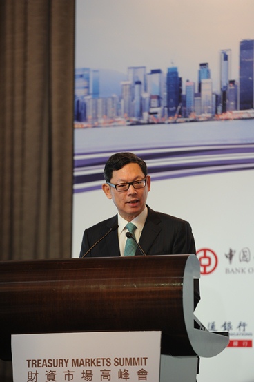 Mr Norman T.L. Chan, Chief Executive of the Hong Kong Monetary Authority, gives the keynote speech at the Treasury Markets Summit 2014 held in Hong Kong