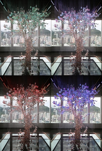 “Chanting Notes” is an art installation of a bauhinia tree created with shredded currency notes that are no longer fit for circulation, with lighting effects highlighting the beauty of the tree in all four seasons