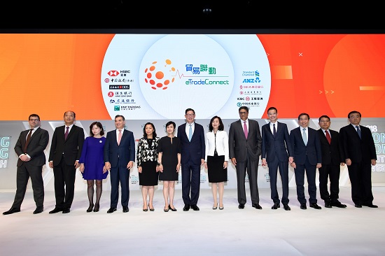 The Chief Executive of the HKMA Mr. Norman Chan and senior executives of 12 banks at the launching ceremony of eTradeConnect.