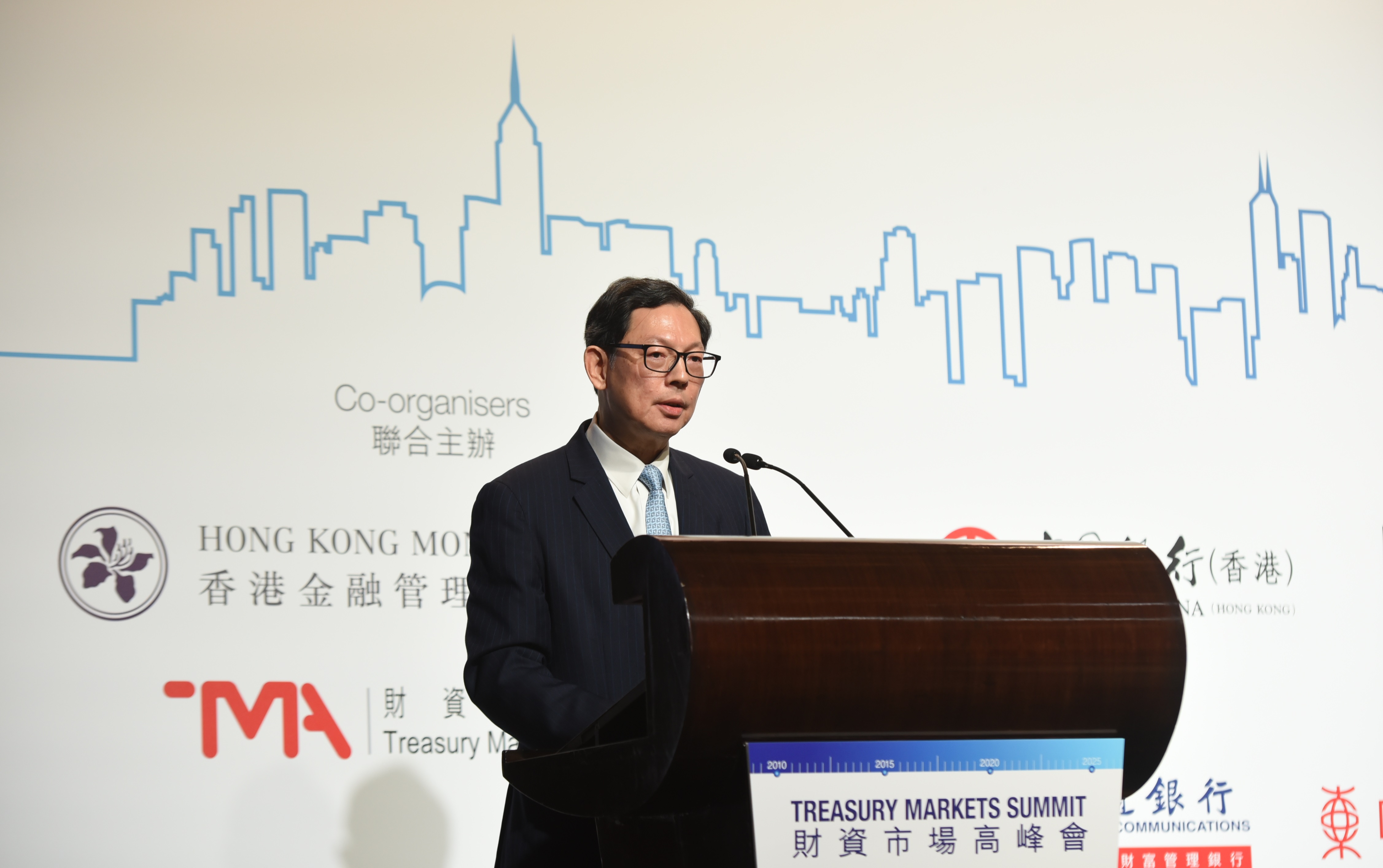 Mr Norman Chan, Chief Executive of the HKMA, gives the welcoming remarks and keynote speech at the Treasury Markets Summit 2019 held in Hong Kong.