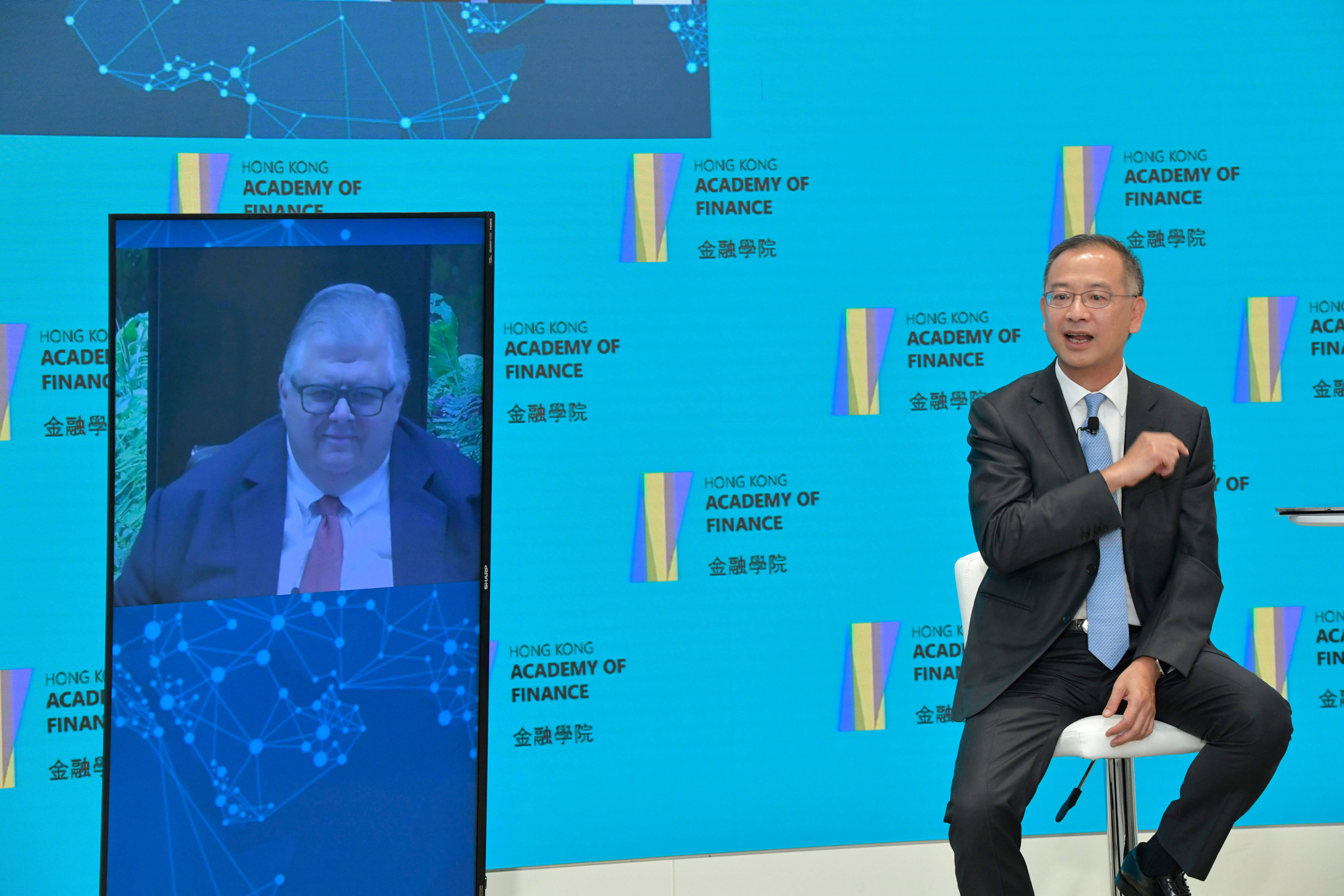 Mr Eddie Yue, Chief Executive of the HKMA and Chairman of the AoF conducts a dialogue with Mr Agustín Carstens, General Manager of BIS at the webinar, on economic and financial issues in the process of economic recovery from Covid-19 and beyond.