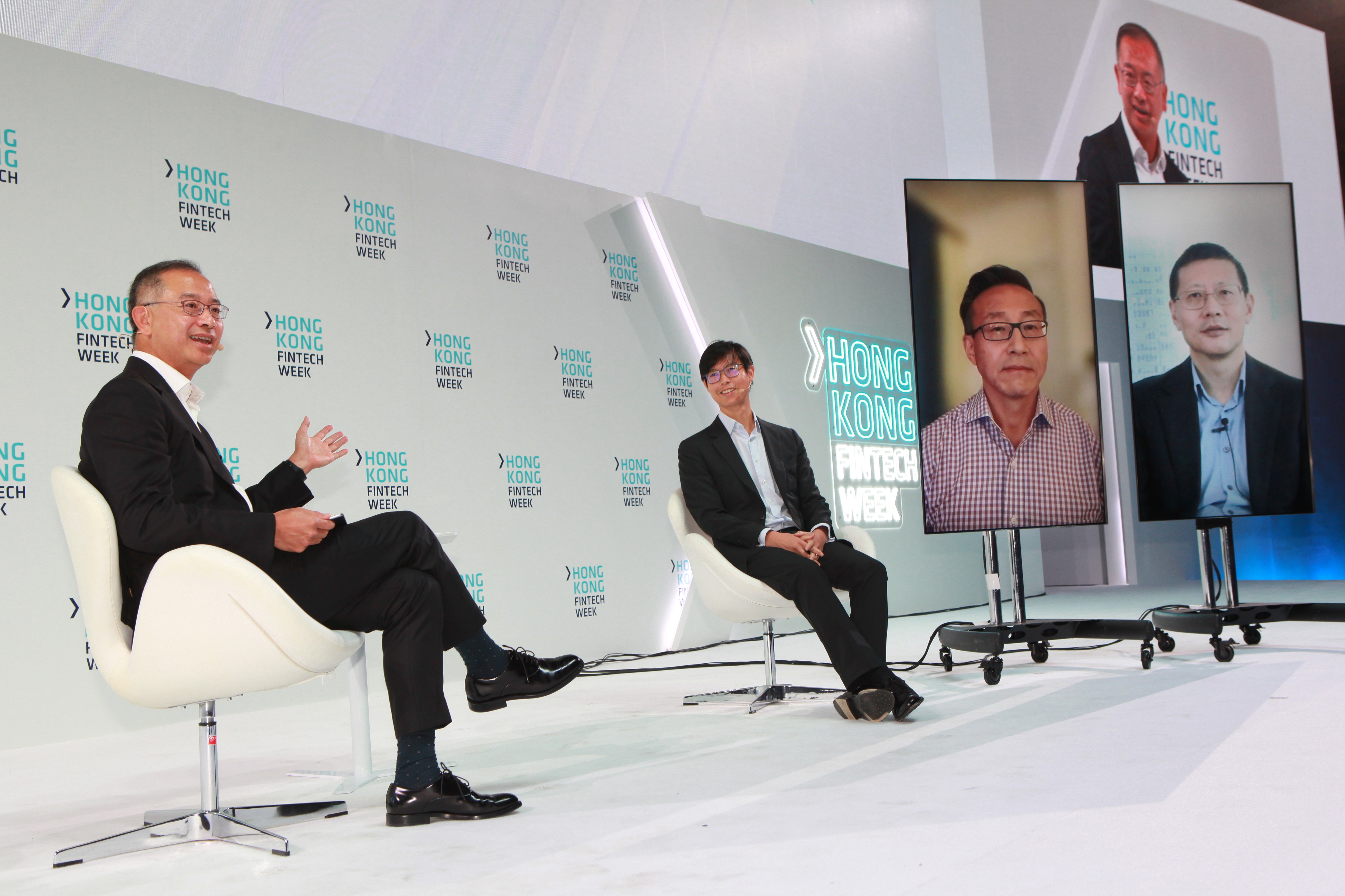 Mr David Liao, Co-Chief Executive, Asia Pacific, HSBC (second from left), Mr Joe Tsai, Co-founder and Executive Vice Chairman, Alibaba Group (second from right), and Mr Neil Shen, Founding and Managing Partner of Sequoia Capital China (first from right), share their views on digital transformation, the future of finance, and leadership in a panel discussion moderated by Mr Eddie Yue, Chief Executive of the Hong Kong Monetary Authority during the Hong Kong FinTech Week 2021.