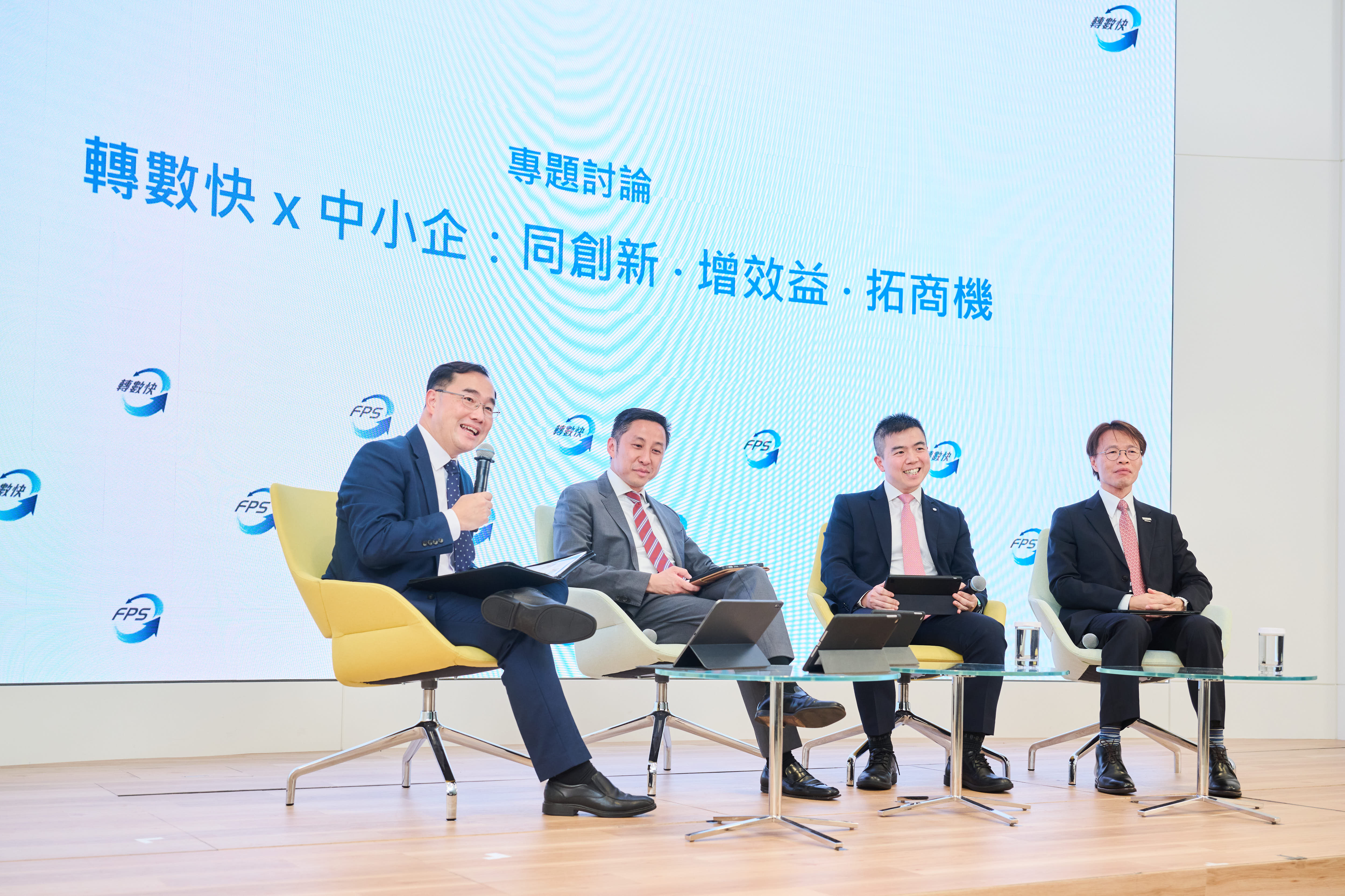 (From left) Mr Colin Pou, Executive Director (Financial Infrastructure) of the Hong Kong Monetary Authority moderates the panel discussion of the seminar.  Mr Jaff Lau, Managing Director, Head of Strategy and Innovation, Business Banking of the Hongkong and Shanghai Banking Corporation Limited; Mr Neo Lau, Assistant General Manager, Commercial Banking Department of the Bank of China (Hong Kong) Limited; and Dr Thomas Su, Vice-Chairman, Small & Medium Enterprises Committee of the Hong Kong General Chamber of Commerce, participate in the discussion.