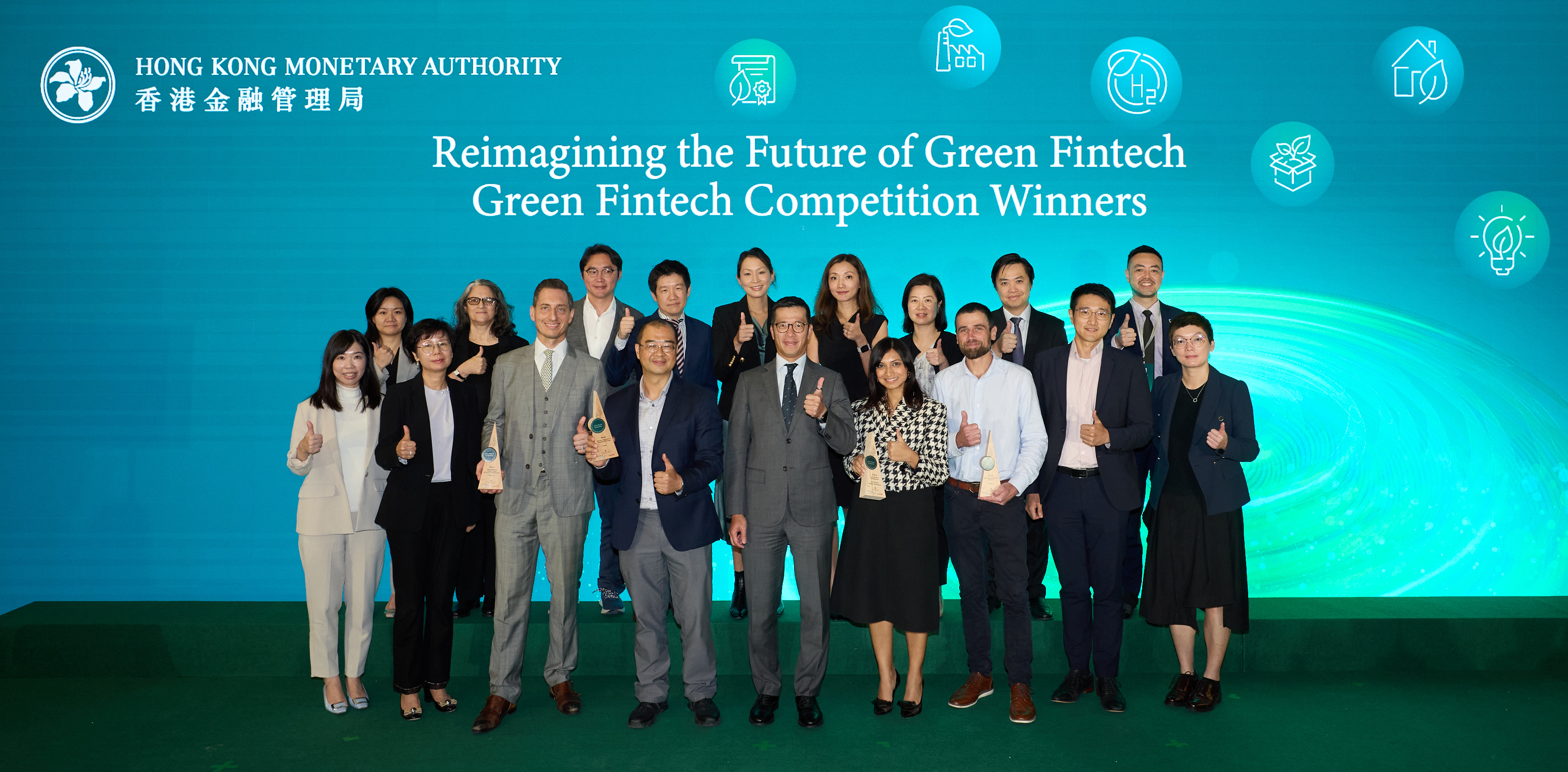 Mr Donald Chen, Executive Director (Banking Policy) of the HKMA (front row, centre), presents the awards to the winners of the Green Fintech Competition at the Green and Sustainable Banking Conference. The photo shows Mr Chen, the winners and the judging panel. 