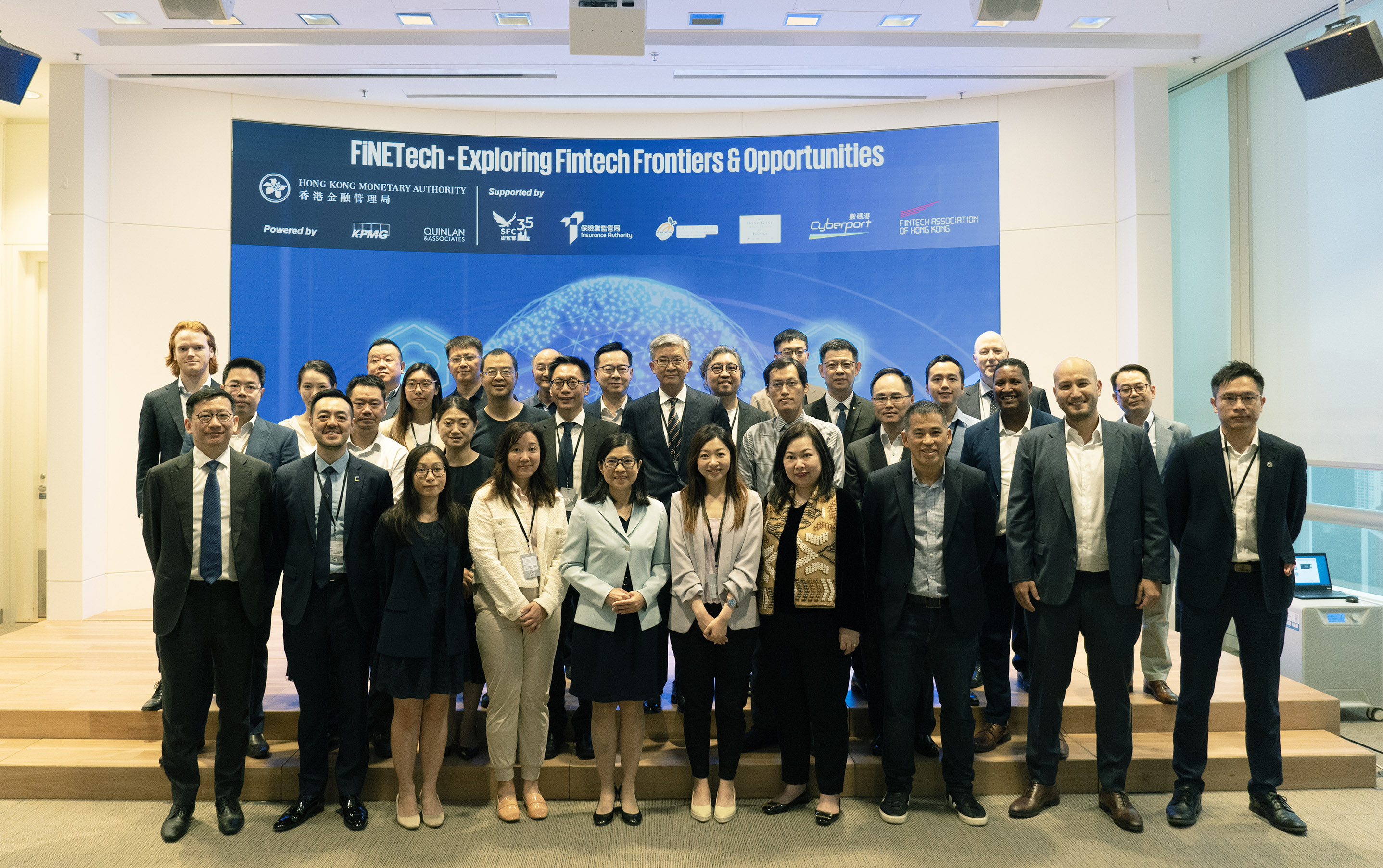 Ms Carmen Chu, Executive Director (Banking Supervision) (fifth from left, first row) and representatives from financial regulators, banks and other financial institutions, industry associations and Fintech solutions providers at the inaugural FiNETech.