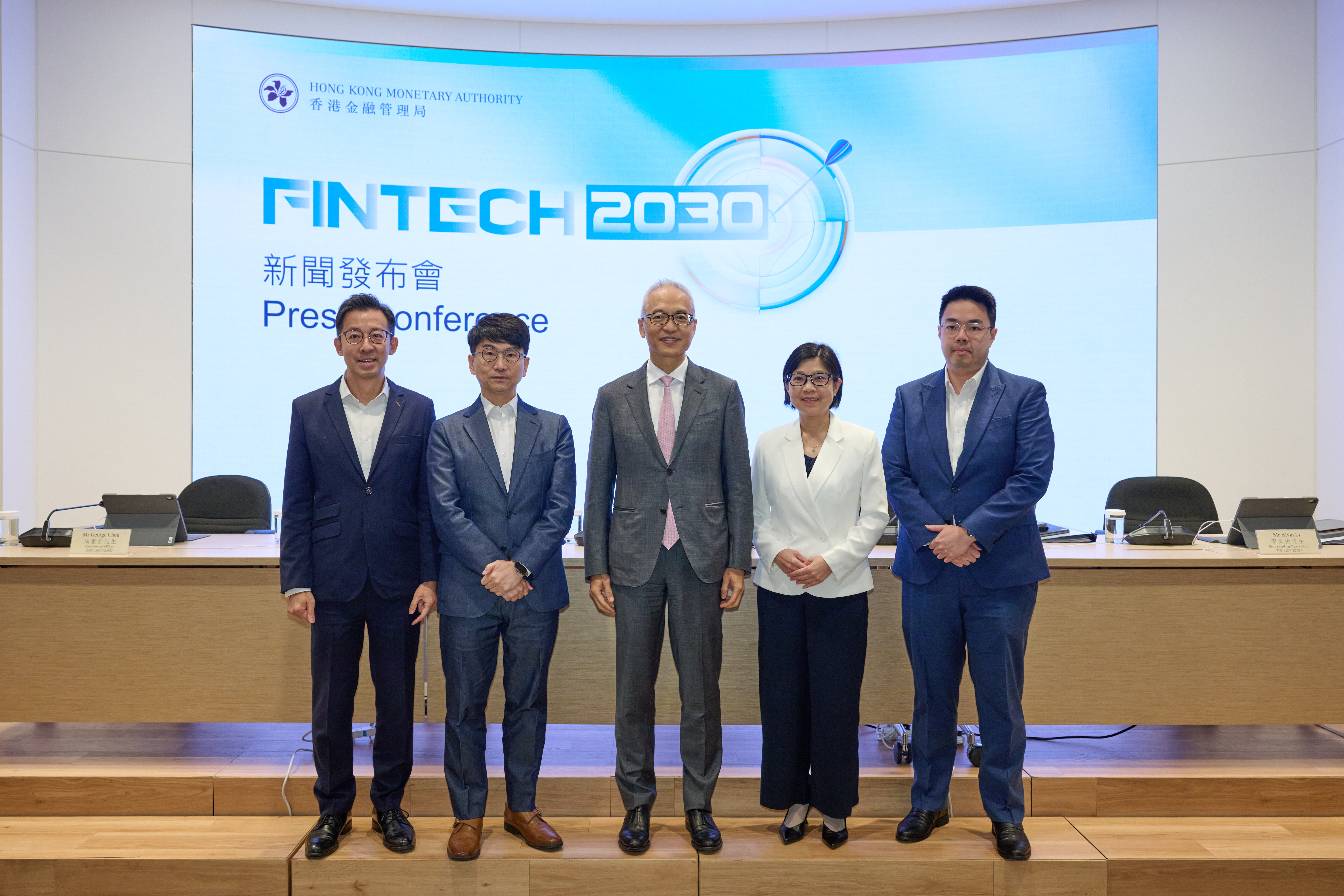 Mr Howard Lee, Deputy Chief Executive (centre), Ms Carmen Chu, Executive Director (Banking Supervision) (second right), Mr Nelson Chow, Executive Director (Financial Infrastructure) (second left), Mr George Chou, Chief Fintech Officer (first left), and Mr Alvin Li, Head (Banking Supervision) (first right) of the HKMA, highlight the details of the “Fintech 2030”.